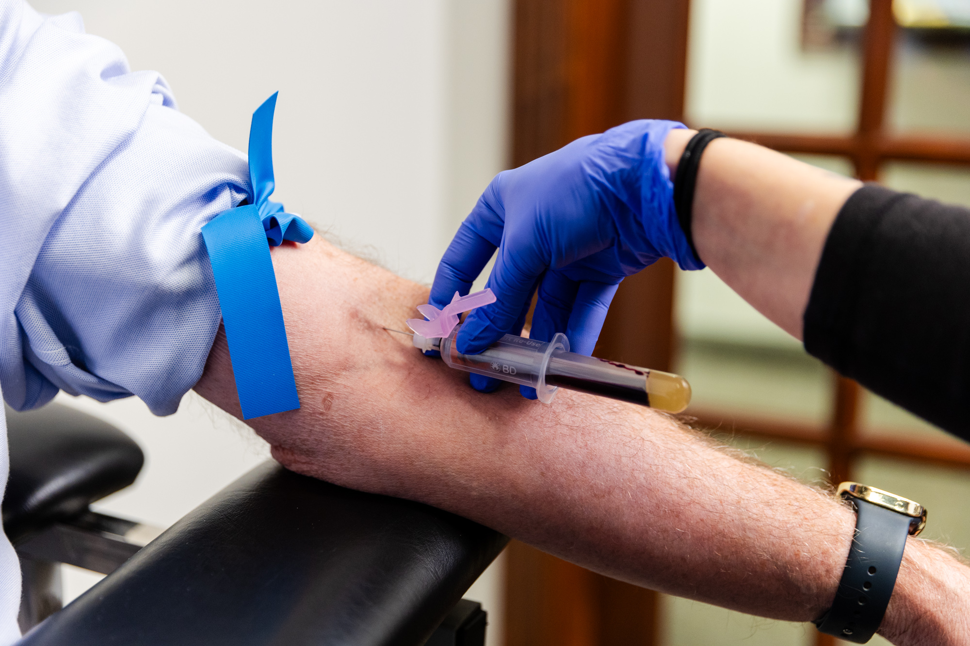 Dr. Cady, our mental health therapist in Newburgh, tests a blood sample to find the cause of patient symptoms.